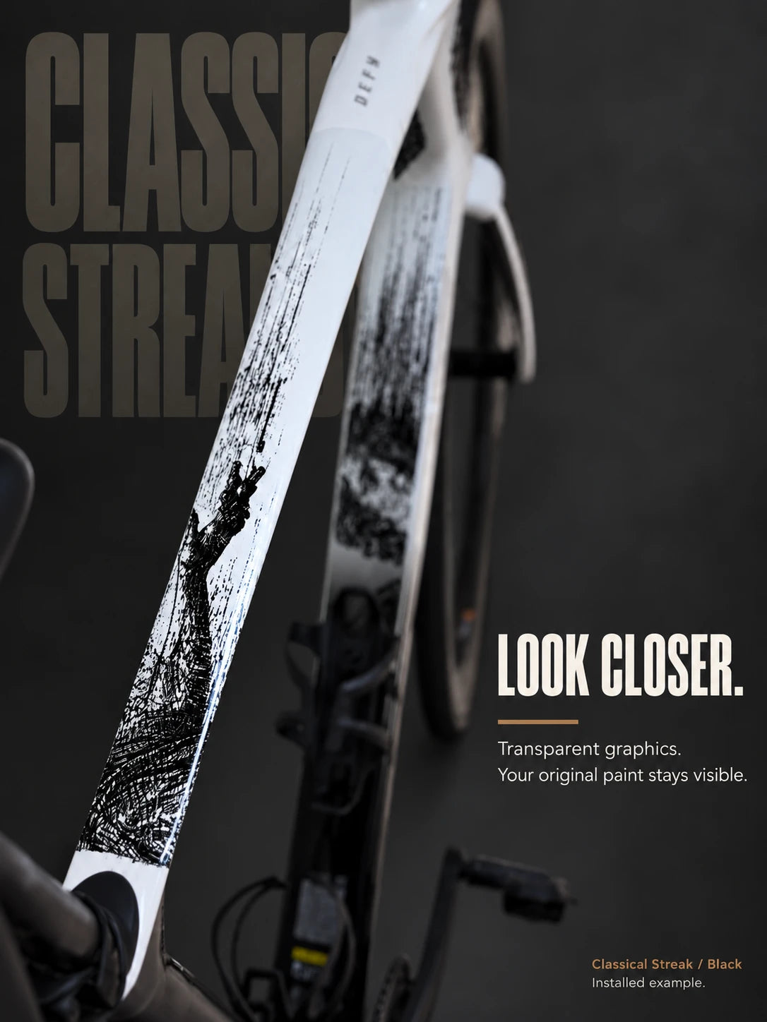 Classical Streak installed on a white road bike: reaching hand and wing artwork on the top tube.