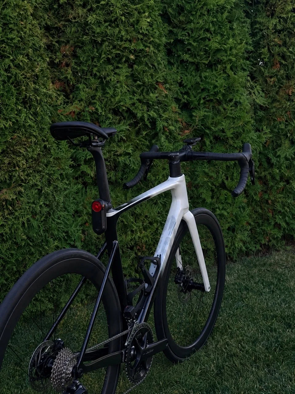 Black and white road bike photographed outdoors before Puresteez graphics were applied